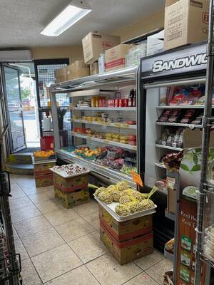 Busy corner grocery store beside subway station priced for sale