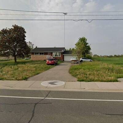 Industrial Zoned Lot with Bungalow For Sale in Hamilton